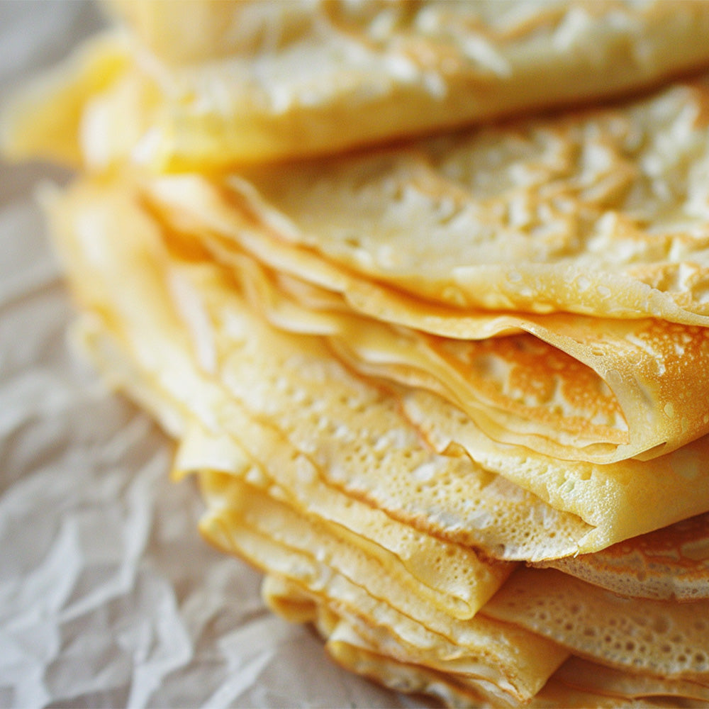 Stack of crepes on parchment paper