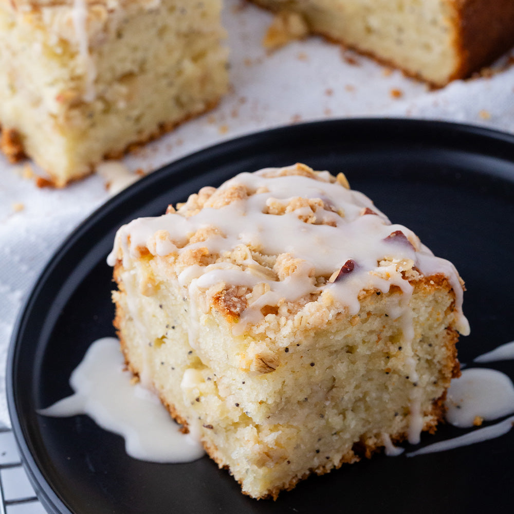 Piece of coffee cake on a black plate