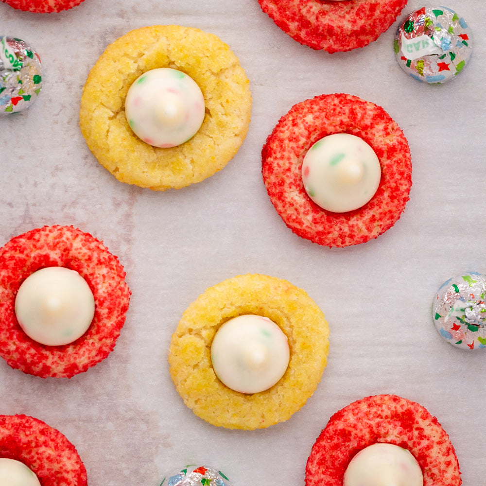 Red and gold cookies on parchment paper