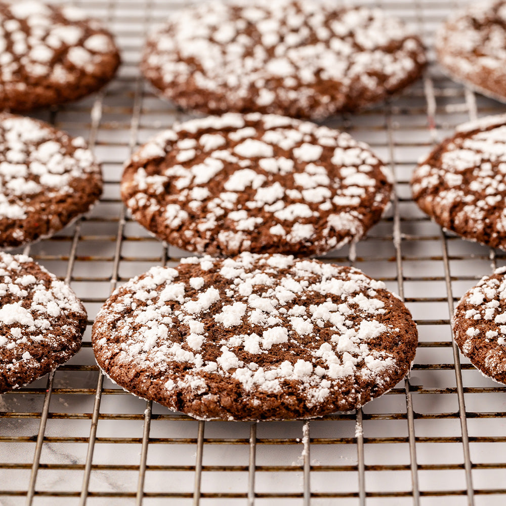 Chocolate crinkle cookies on a wire rack