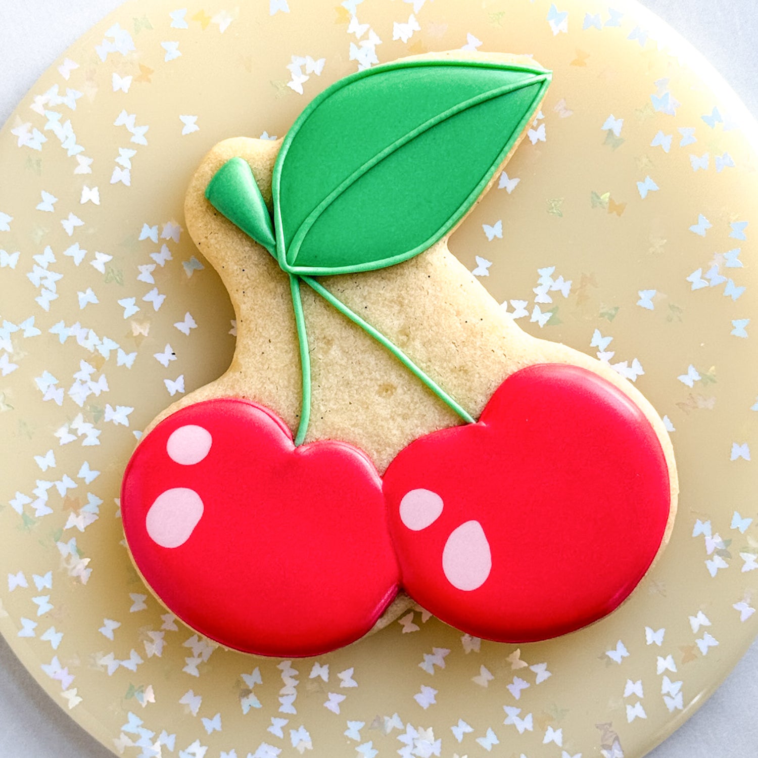 Pair of cherries sugar cookie on a cookie turntable