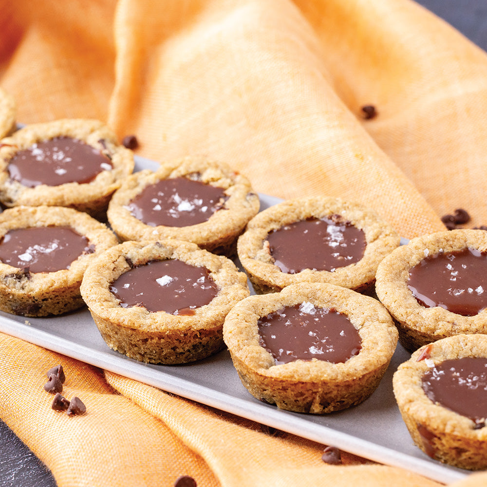 Chocolate filled cookie cups on a long rectangular plate