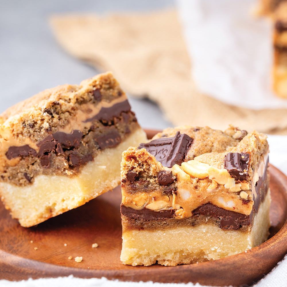 Cookie bars on a wooden plate